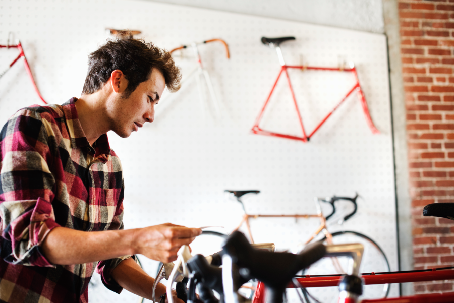 A man browsing bikes at Le District Vélo